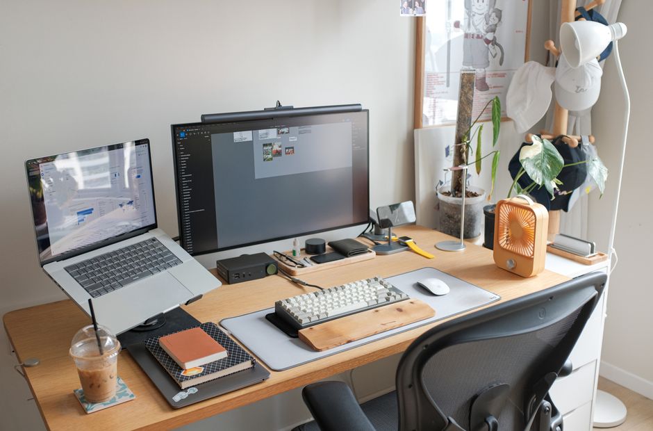 Sleek office setup featuring a laptop, monitor, and stylish accessories