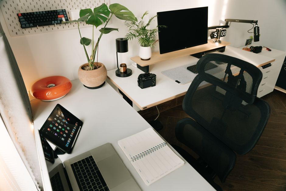 Stylish home office setup featuring tech gadgets and decorative plants